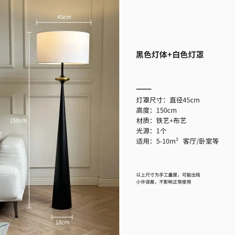 A sleek black DecorBites LED iron floor lamp with white fabric shade and gold accent for living room and bedroom