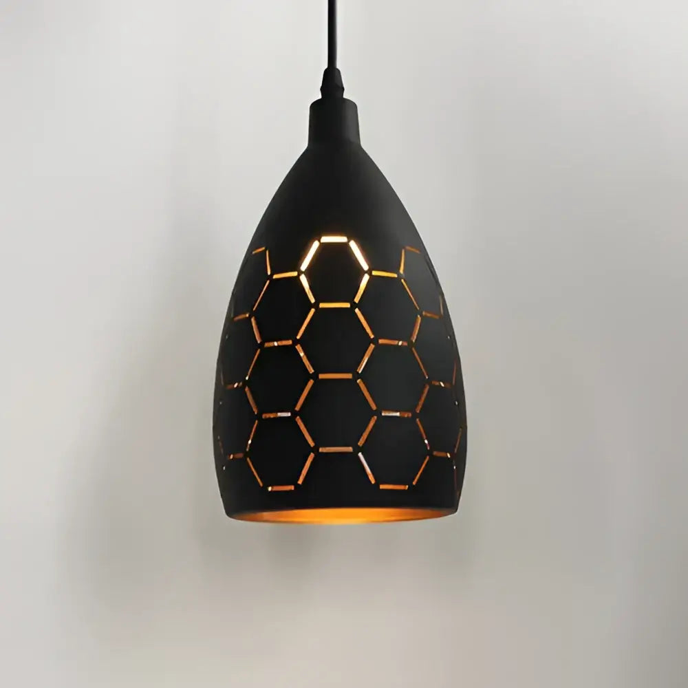 Black DecorBites LED iron cage pendant light with honeycomb pattern and warm golden interior glow for living room