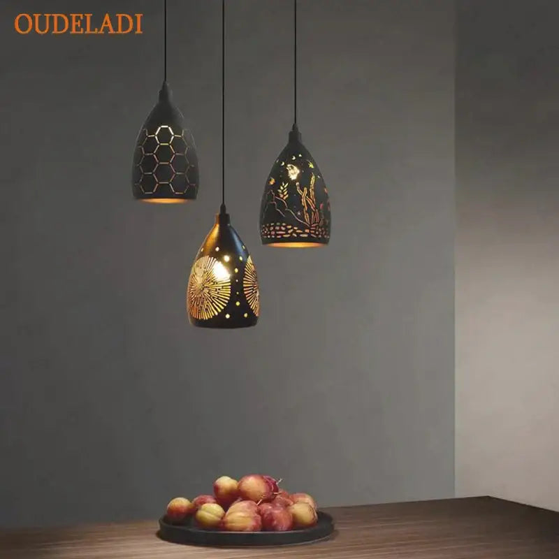 Three black decorbites led iron cage pendant lights with gold-toned cutout patterns for modern living rooms and restaurants