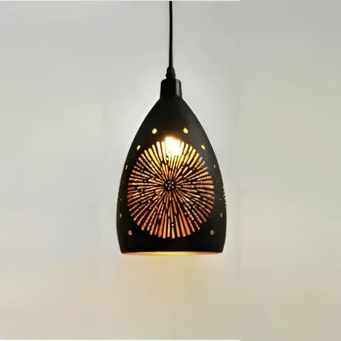 Black decorbites led iron cage pendant light with geometric sunburst cutout design emitting warm golden light