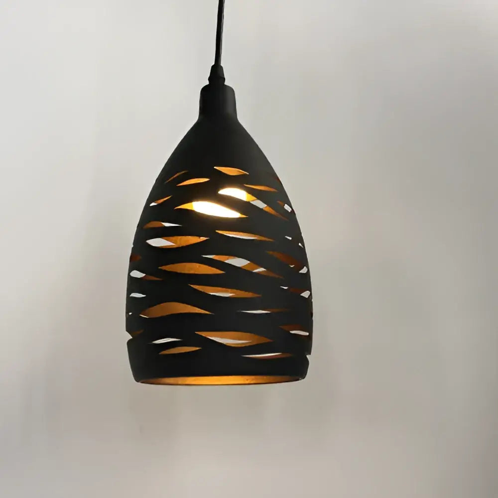 Black teardrop pendant light with intricate cut-out patterns casting warm light decorbites led iron cage fixture