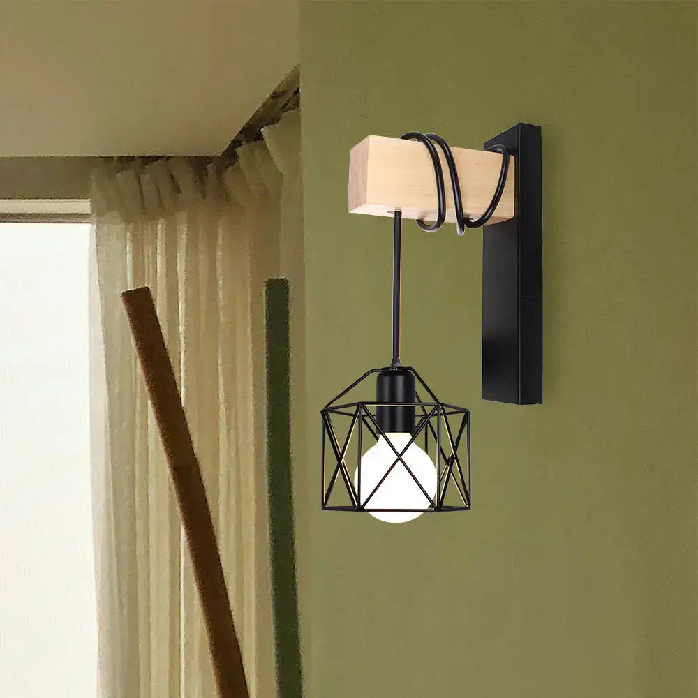 Black metal geometric cage wall light with wooden rectangular backplate and coiled cord decorbites led iron cage