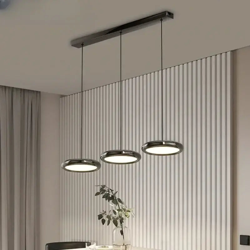 Modern minimalist decorbites led iron pendant light with three chrome lamps suspended from a black rectangular bar
