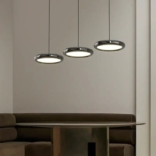 Three sleek decorbites led iron pendant lights with polished chrome finish and circular illuminated glass shades for home decor