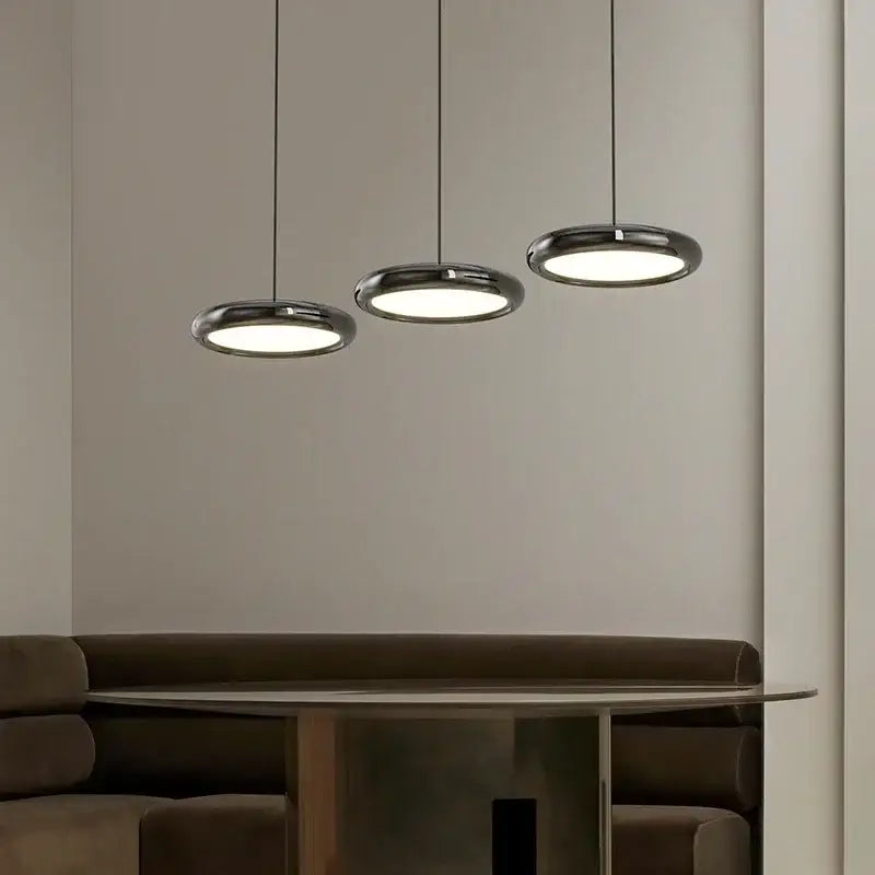 Three sleek decorbites led iron pendant lights with polished chrome finish and circular illuminated glass shades for home decor
