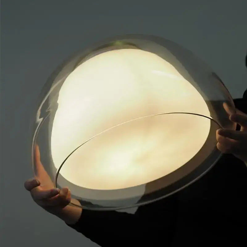 A sleek translucent glass dome pendant light with warm glow for living room by DecorBites led jelly glass