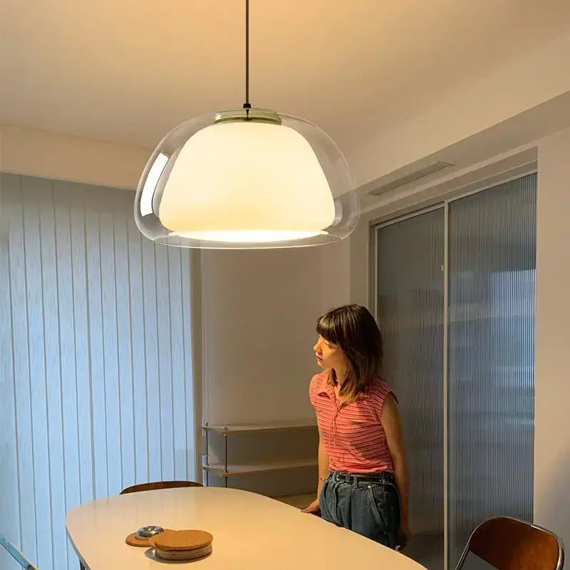 Modern decorbites led jelly pendant light with transparent glass shade, warm light, and metal frame for dining table