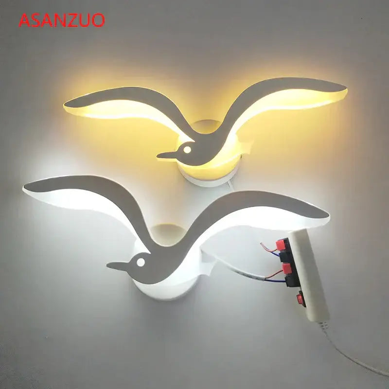 Two decorbites led jellyfish wall sconce lamps shaped like seagulls glowing warm yellow and cool white for indoor use