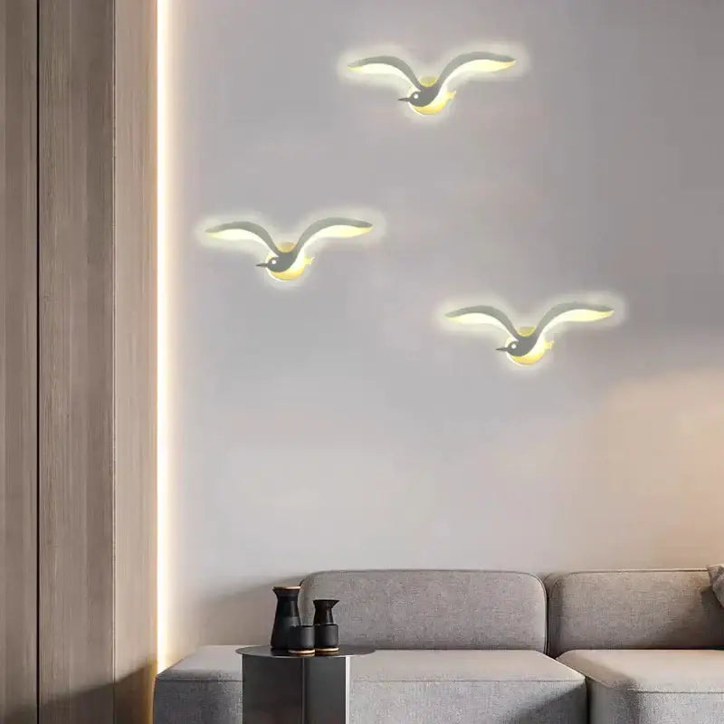 Three modern minimalist seagull-shaped warm led lighting wall sconces from decorbites led jellyfish wall series