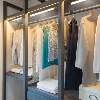 Modern gray wood walk-in closet with decorbites led kitchen cabinet light and integrated hand sweep sensor lighting
