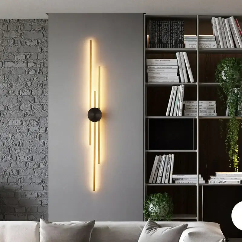 Decorbites led long wall lamp with slender gold-toned bars and black base emitting warm light for living spaces