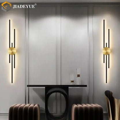 Gold-toned decorbites led long wall lamp with vertical black bars and circular accents for modern living spaces