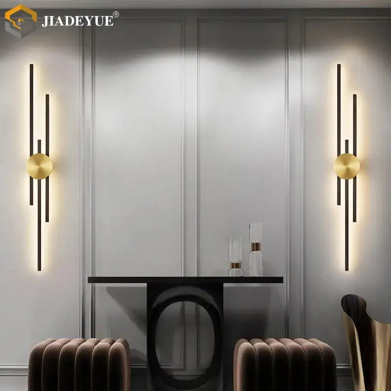 Gold-toned decorbites led long wall lamp with vertical black bars and circular accents for modern living spaces