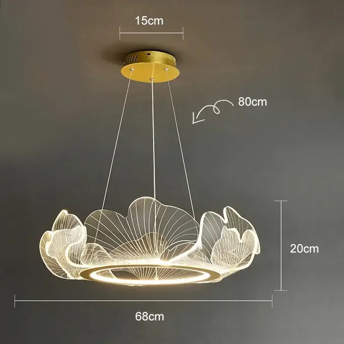 A modern gold-toned decorbites led lotus pendant light with translucent lotus leaf design and illuminated circular base