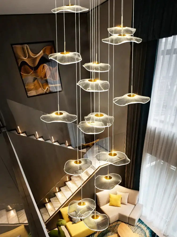 Modern chandelier with translucent fan-shaped glass shades suspended by cables from decorbites led lotus staircase chandelier