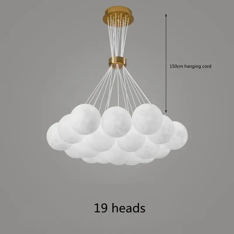 White cloud-shaped DecorBites chandelier with 19 frosted glass globes and gold-toned fixture for home decor lighting