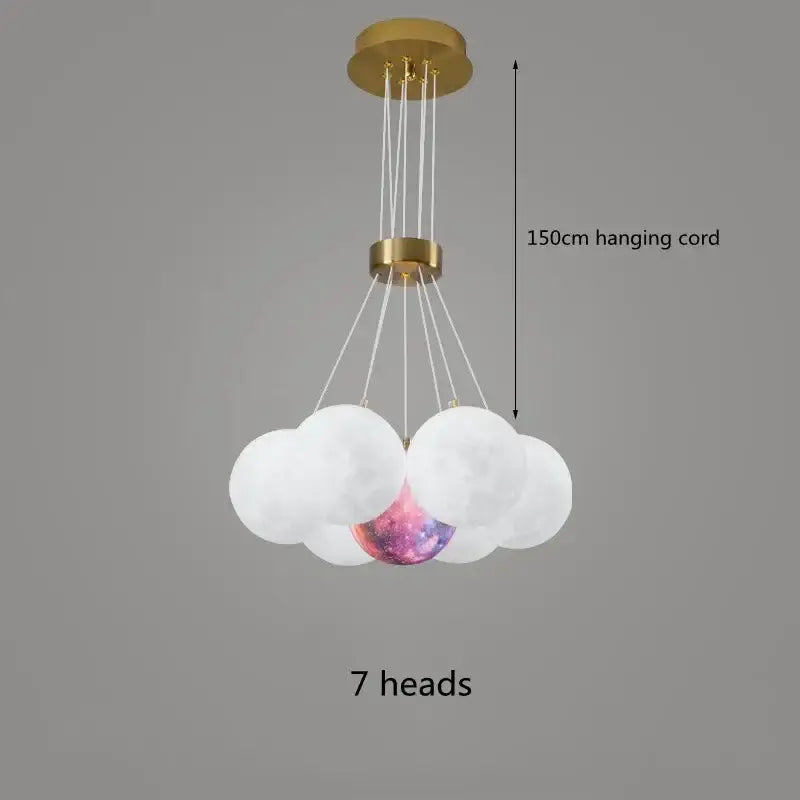 A modern DecorBites LED Lunar ceiling chandelier with gold metal frame and seven glass orbs including galaxy orb for home decor