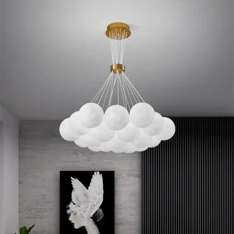 White cloud-shaped pendant light with gold ceiling mount and glass orbs for living room decor by decorbites led lunar
