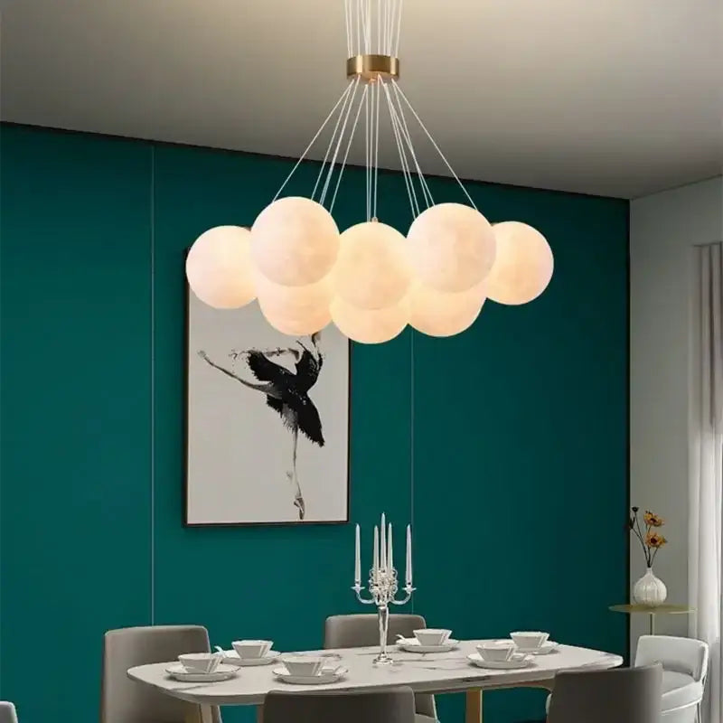 Cloud-shaped decorbites led lunar ball chandelier with off-white spherical bulbs and gold-toned ceiling fixture for home lighting