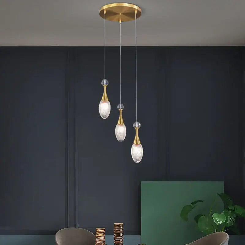 Gold-toned decorbites led luxury chandelier with frosted glass teardrop shades and crystal accents for modern living spaces