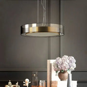 Modern circular pendant light with metallic frame and glass panels in decorbites led luxury chandelier for minimalist decor