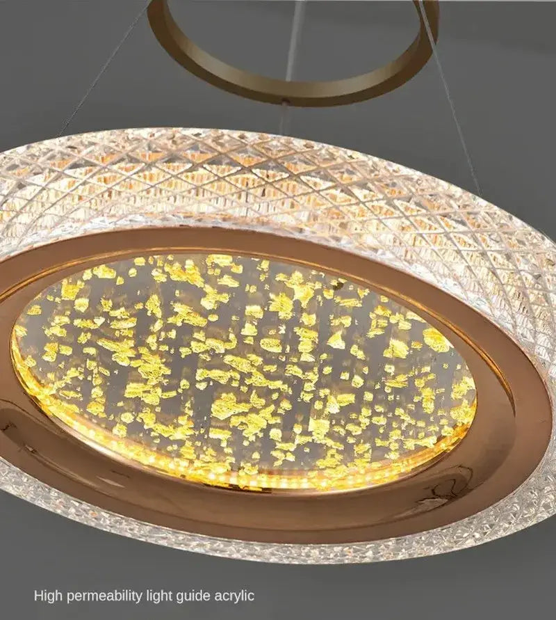 Gold-toned DecorBites LED luxury ring chandelier with textured acrylic diffuser and golden leaf accents for living room decor
