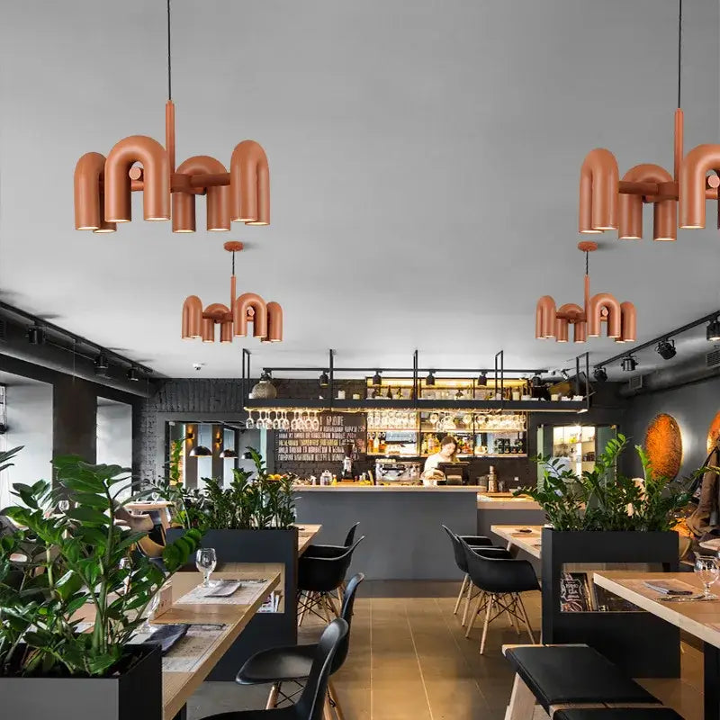 Copper-colored modern industrial pendant chandelier with geometric pipe design by DecorBites led macaron pendant