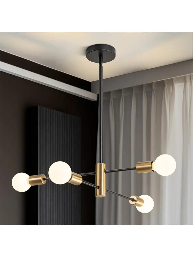 Modern black and brass minimalist magic bean chandelier with six frosted glass bulbs for indoor lighting by decorbites