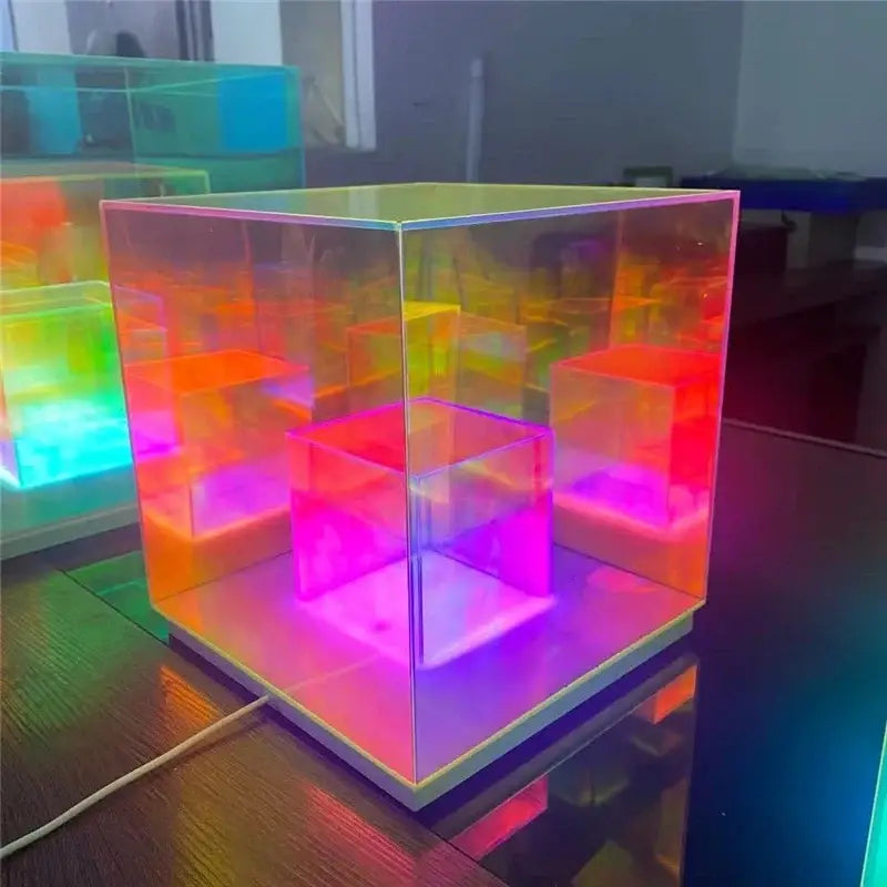 A decorbites led magic cube desk lamp with translucent cube shape and vibrant rainbow-colored led magic illumination