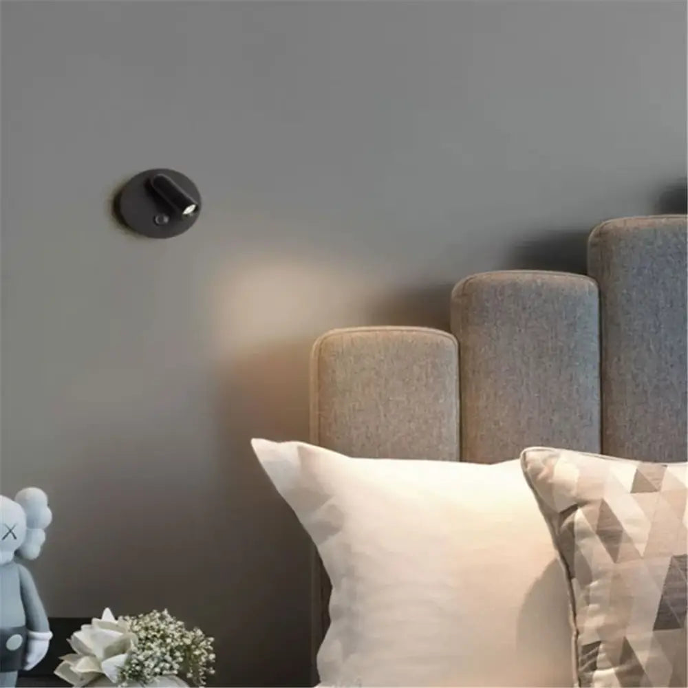 Black circular wall light with a sleek modern design from DecorBites led magnetic dimmable bedside lamp