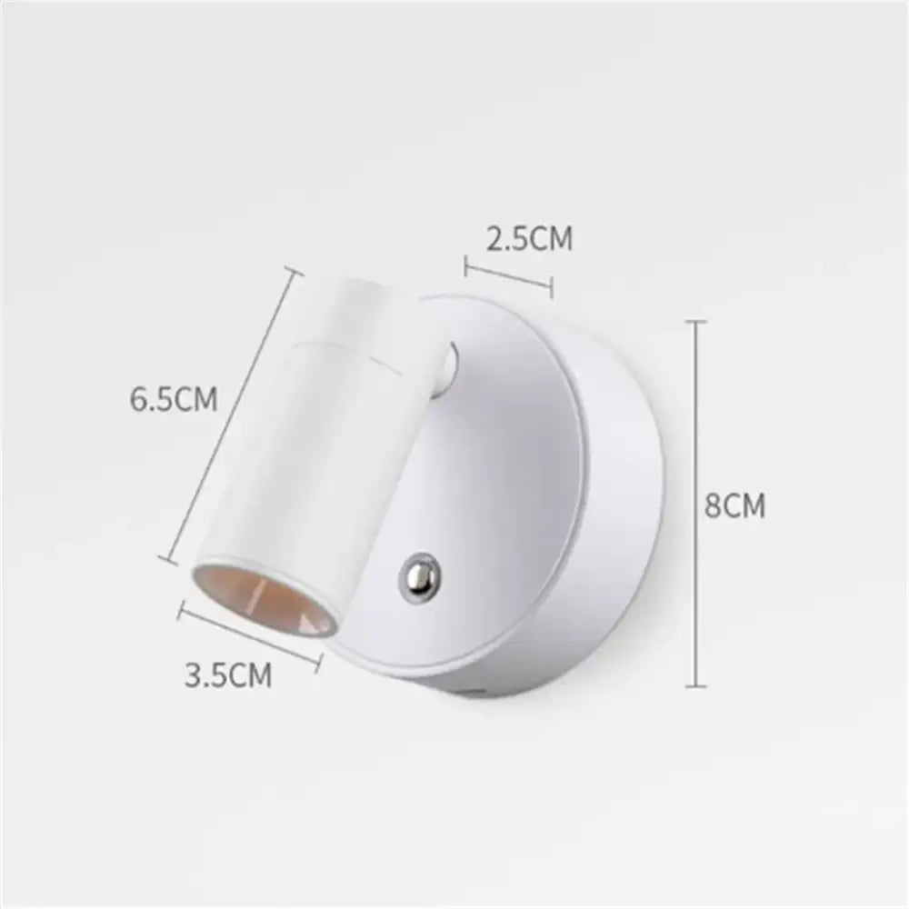 White cylindrical decorbites led magnetic wall light with sleek modern design and metallic screw detail for bedside use