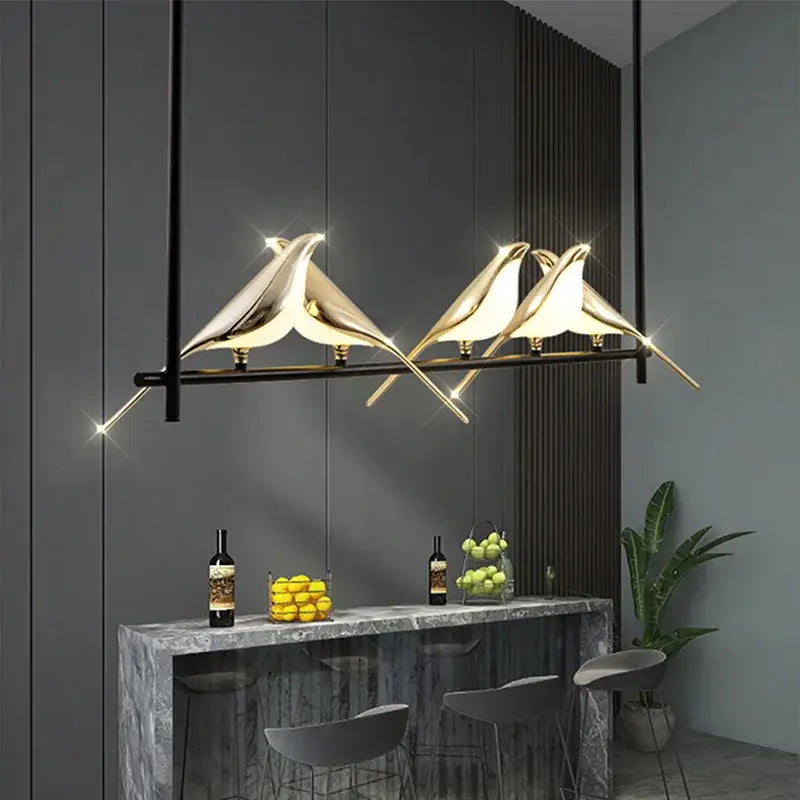 Gold-toned decorbites led magpie pendant light featuring a sleek modern bird design for living and dining room decor