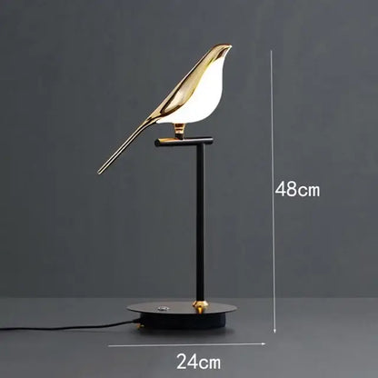 Gold-toned led magpie bird pendant light with sleek minimalist design on black metal stand by decorbites led magpie