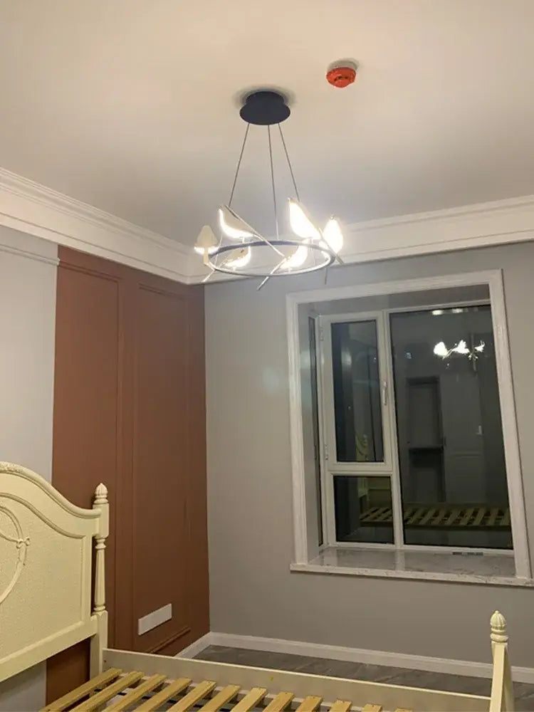 Modern white decorbites led magpie pendant light chandelier with circular frame and curved arms for living and dining room