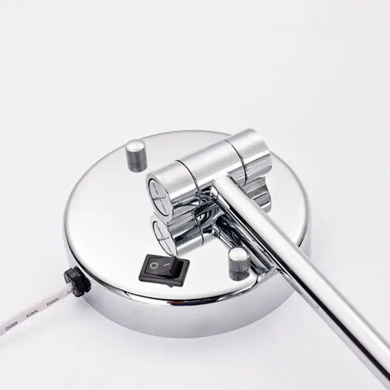 Chrome-finished adjustable desk lamp with circular base and articulated arm shown with decorbites led makeup mirror