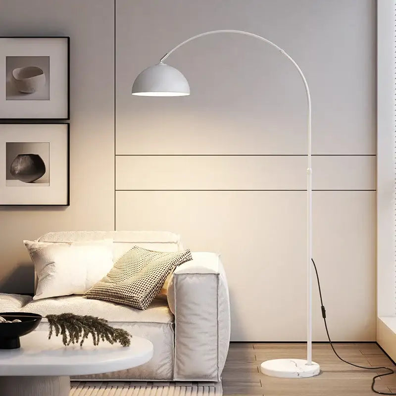 White arched floor lamp with curved metal frame and dome shade featuring decorbites led marble base for modern rooms