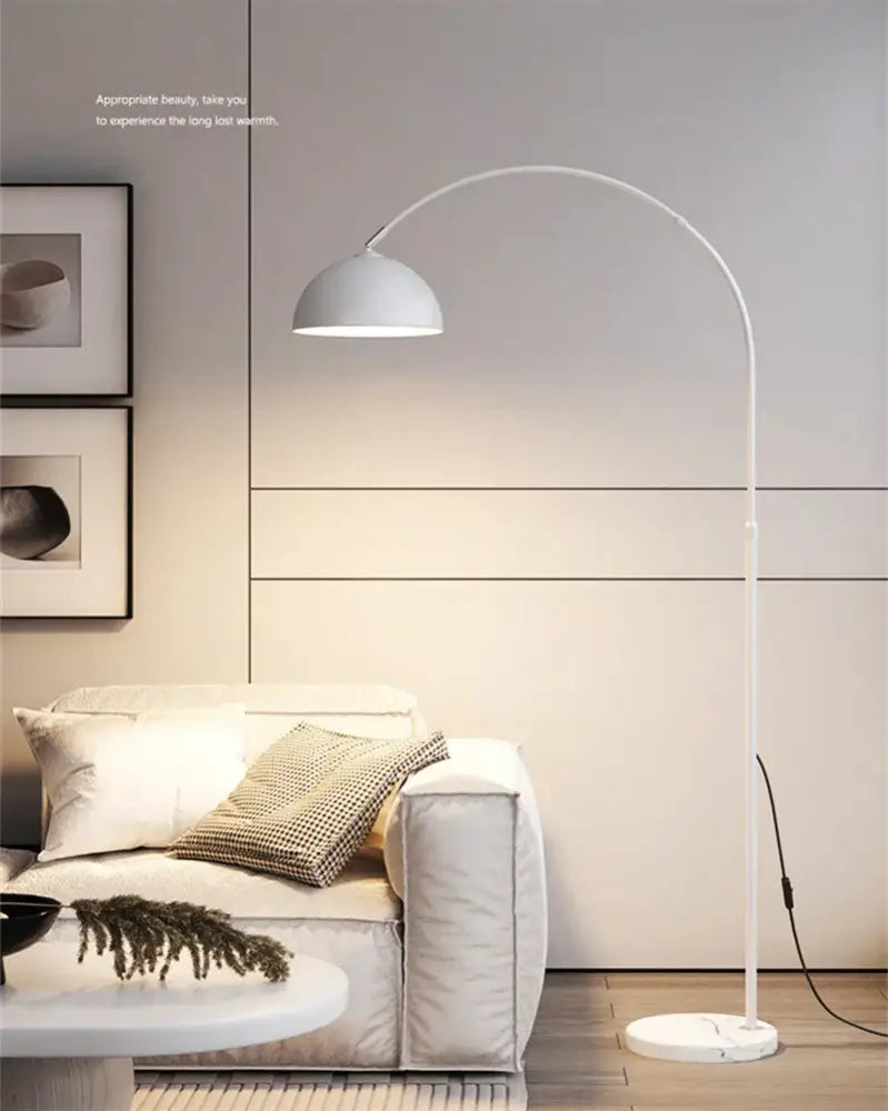 White arched floor lamp with decorbites led marble base and sleek matte metal frame for modern living room lighting