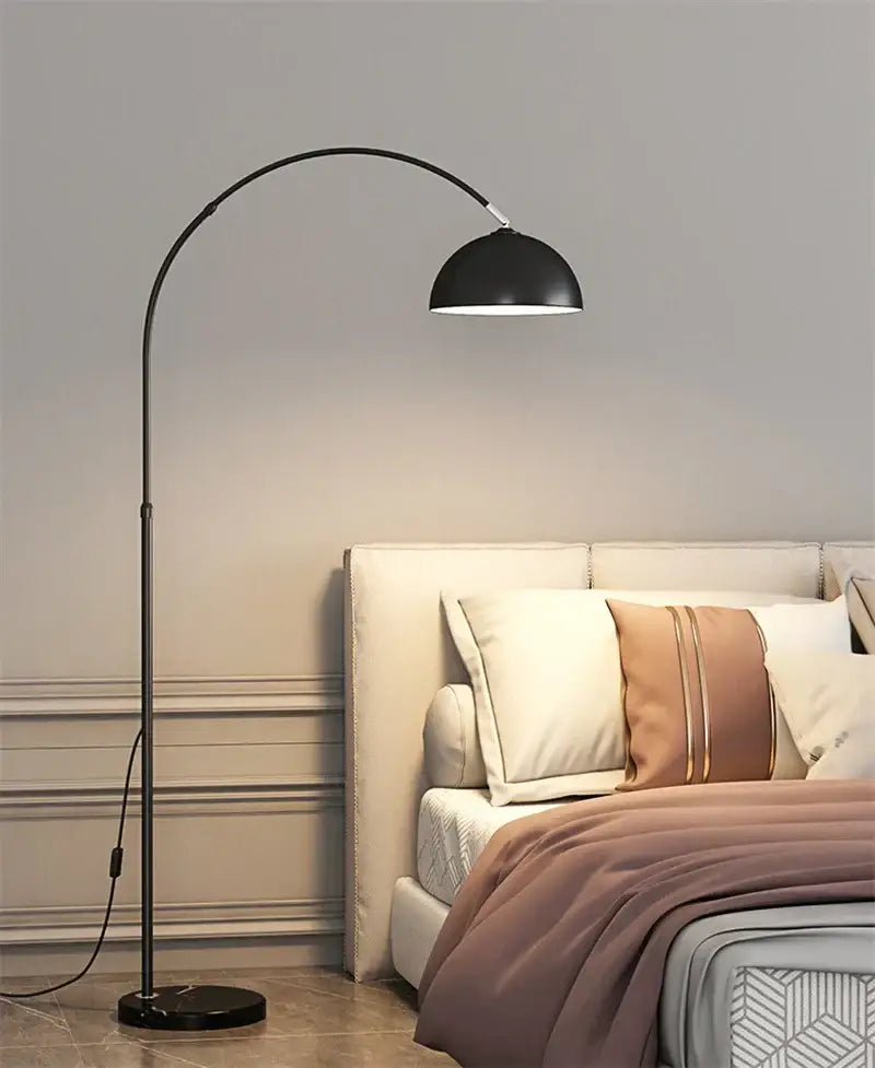 Black arched floor lamp with a sleek curved metal frame and marble base by DecorBites LED for modern living room lighting