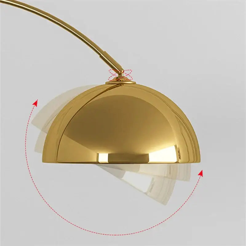 Gold-colored polished dome-shaped lampshade with curved metallic arm on decorbites led marble base floor lamp