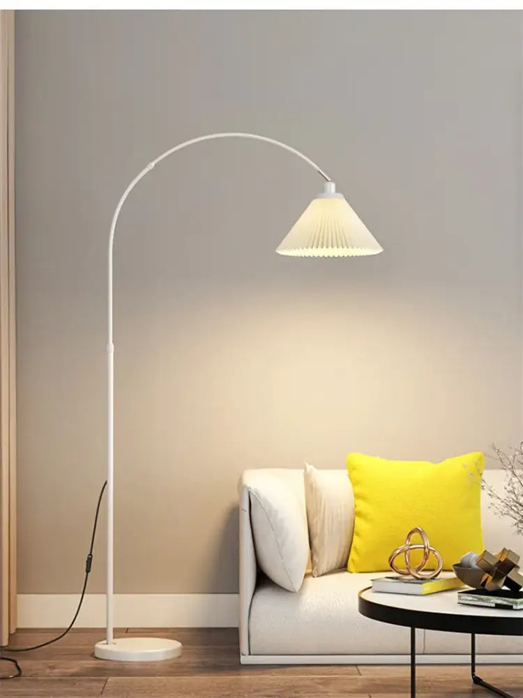 White arched floor lamp with pleated translucent shade and marble base from DecorBites LED marble collection for modern lighting