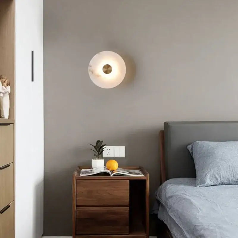 Minimalist decorbites led marble brass wall sconce with frosted white glass shade and brass accent for modern interiors