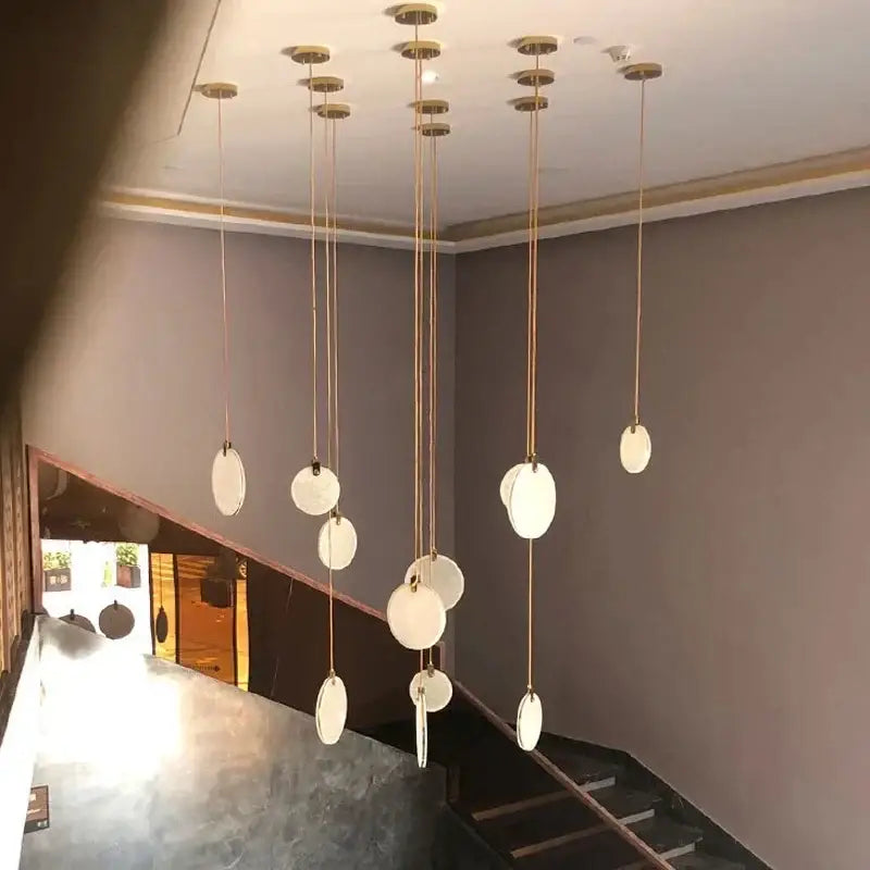 Modern minimalist pendant lamp with frosted glass and brass cords from decorbites led marble ceiling collection