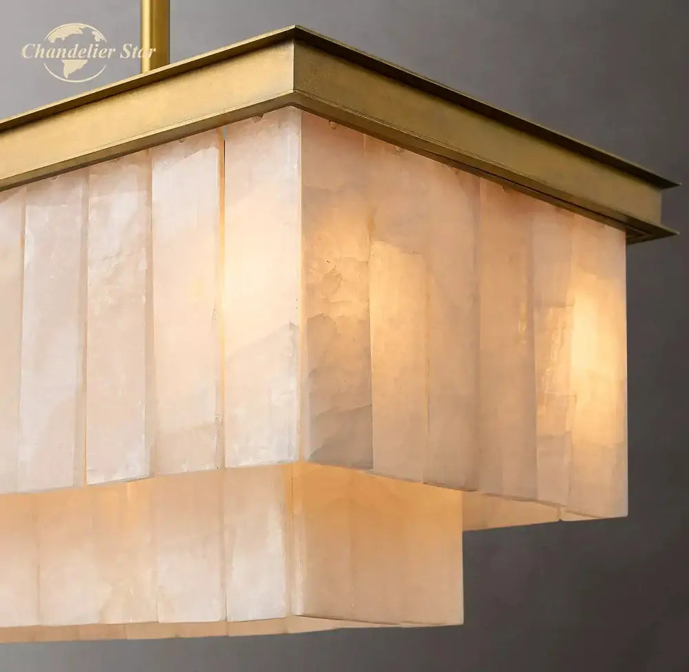 A modern decorbites led marble rectangular chandelier with brass frame and translucent panels for kitchen island and dining room