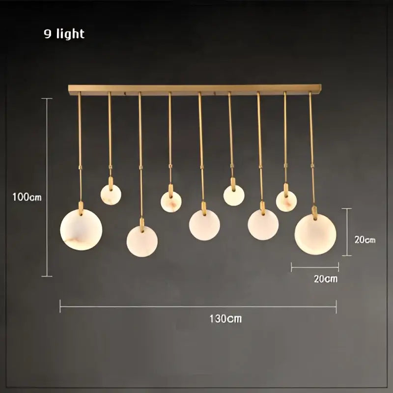 DecorBites LED marble gold chandelier with nine frosted glass shades suspended from a gold-toned bar for living room