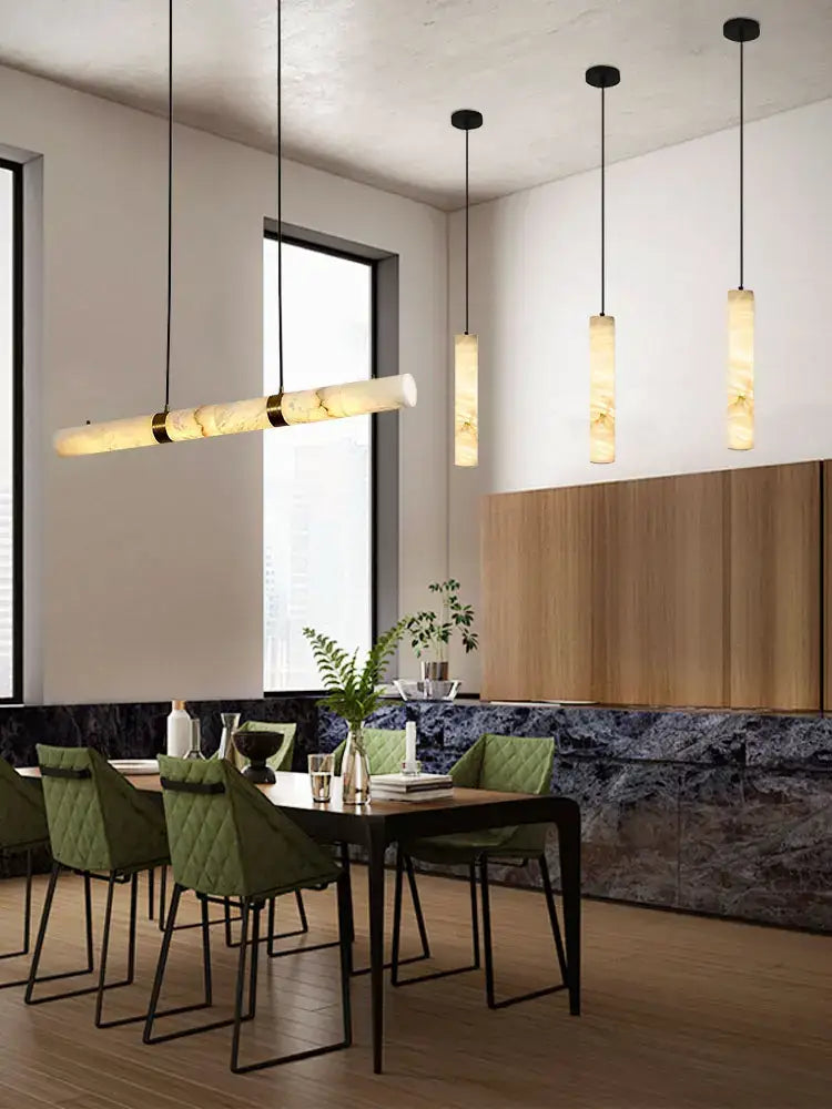 Modern pendant hanging lamps with warm led marble white alabaster shades and sleek black metal fixtures