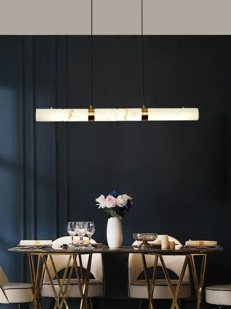 DecorBites™ LED marble hanging lamps in white alabaster with gold accents illuminate dining spaces elegantly