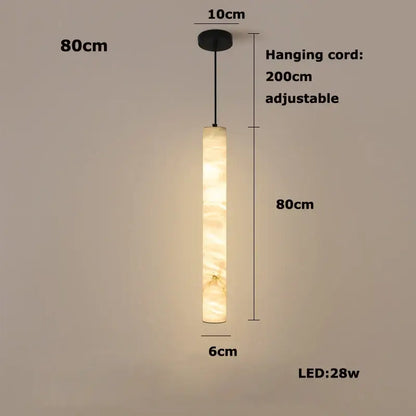 A warm beige cylindrical decorbites™ led marble hanging lamp with white alabaster texture for ambient lighting