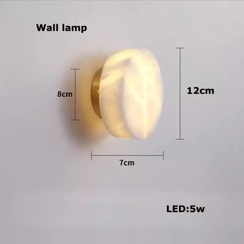 A decorbites™ led marble hanging lamp with a white alabaster glass shade and polished brass base wall mounted