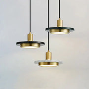Modern DecorBites LED marble pendant light with gold-toned metal fixtures and black and white circular discs for luxury decor