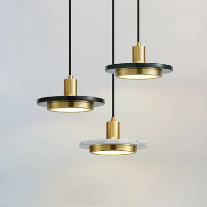 Modern decorbites led marble pendant light with black marble disc and polished brass accents for dining and bedroom use